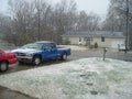 Red mazda 626 and Blue Dodge Dakota in a snowy driveway in saint charles mo