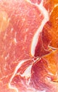 Red meat texture close up photo. Italian prosciutto crudo or jamon. Raw ham. Pork meat background