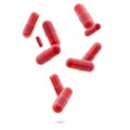 red medical gel capsules falling down on white background. food supplement, pharmacy concept. pills