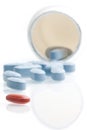 Red medical pill in front of blue pills in laboratory near white container Royalty Free Stock Photo