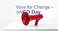 A red megaphone on a white surface with the text voice for change and nco day in the background Royalty Free Stock Photo