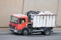 Red Mercedes Atego crane truck circulating along the Ronda litoral de Barcelona