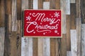 Red Merry Christmas concept on wood plank background, for holiday projects Royalty Free Stock Photo