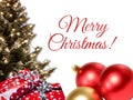 Red Merry Christmas Handwriting With Xmas Tree And Gift Box, Shiny Balls. Royalty Free Stock Photo