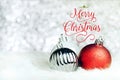 Red Merry Christmas over decoration ball on white fur at silver Royalty Free Stock Photo