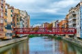 Red metal Eiffel bridge over the Onyar river in Girona, Spain Royalty Free Stock Photo