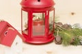 Red metal lantern has a burning candle. Royalty Free Stock Photo