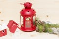 Red metal lantern has a burning candle. Royalty Free Stock Photo