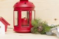 Red metal lantern has a burning candle. Royalty Free Stock Photo