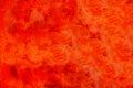 Red wall painted with strong red and orange vivid colours as colourful metallic surface texture background Royalty Free Stock Photo