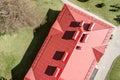 Red metal roof of house with vent pipes and dormer windows. drone photography Royalty Free Stock Photo