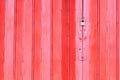 Red metal sheet folding door was locked with padlock Royalty Free Stock Photo