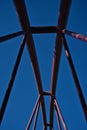 Red metal structure of a bridge against the blue sky Royalty Free Stock Photo
