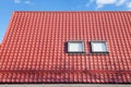 Red Metal tiled Roof with New Dormers, Roof Windows, Skylights and Roof Protection from Snow Board Royalty Free Stock Photo