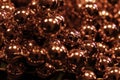 Red metallic balls. Christmas decoration garland. Close up