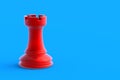 Red metallic chess figure rook on blue background Royalty Free Stock Photo