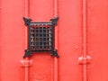 Red metallic door with peep hole. Royalty Free Stock Photo