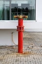 Red metallic fire hydrant Connection on street Royalty Free Stock Photo