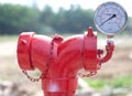 Red metallic fire hydrant with pressure gauge or Fire Department Royalty Free Stock Photo