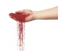 Red metallic glitter sparkle fall from hand. Red Glitter sand spark blink celebrate Chinese new year, particle pour from hand.