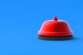 Red metallic hotel bell on blue background. Administrator call. Urgent requirement