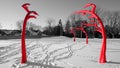 Red metal sculpture in a park