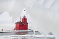 Red Michigan lighthouse framed in ice Royalty Free Stock Photo