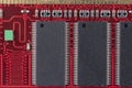Red microcircuit of old computer random access memory with black microcircuits, top view Royalty Free Stock Photo