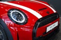 Red Mini Cooper BMW of automotive concern BMW Group closeup, British Motor Corporation BMÃÂ¡ in showroom, car dealership,