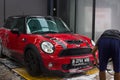 Red mini cooper car wash Royalty Free Stock Photo