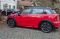 Red Mini Cooper Countryman is parked on a street. Mini Cooper Clubman S All4 car exterior Royalty Free Stock Photo