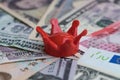 Red miniature crown on international money using as world finan Royalty Free Stock Photo