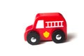 red miniature wooden truck on white background - concept fire rescue Royalty Free Stock Photo