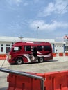 A Red Minibus in a Bus Station, Semarang, Indonesia.