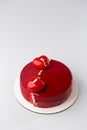Red mirror half glazed and velor entremets with mini hearts and gold. Royalty Free Stock Photo