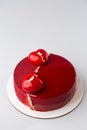 Red mirror half glazed and velor entremets with mini hearts and gold. Royalty Free Stock Photo