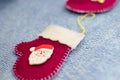 Red mittens with Santa Claus on a blue background