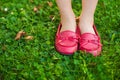 Red moccasins on child's feet Royalty Free Stock Photo