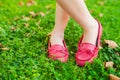 Red moccasins on childs feet Royalty Free Stock Photo