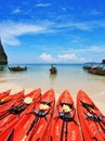 Red modern canoes and boats Longtail on a beach Royalty Free Stock Photo