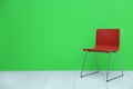 Red modern chair on wall background Royalty Free Stock Photo