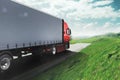 Red modern truck moving fast on the road with natural landscape Royalty Free Stock Photo