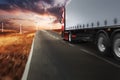 Red modern truck moving fast on the road at sunset Royalty Free Stock Photo