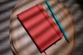 red moleskine with pencil on wooden background for mockup. Royalty Free Stock Photo