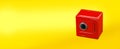 Red moneybox piggy bank made as safe. on yellow Royalty Free Stock Photo