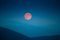 Red moon on the hills in Tuscany