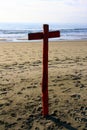 Red mooring pole in the shape of a cross, in sunset light Royalty Free Stock Photo