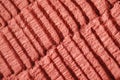 Red moroccan cosmetic clay powder texture close up, selective focus