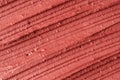 Red moroccan cosmetic clay texture close up.