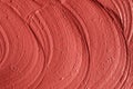 Red moroccan cosmetic clay texture close up.